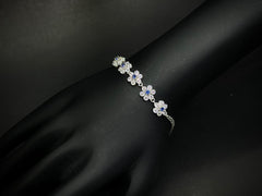 Bloom Radiance – 925 Silver Floral Dancing Stone Bracelet